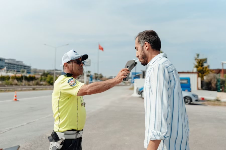A man taking a breathalyzer test
